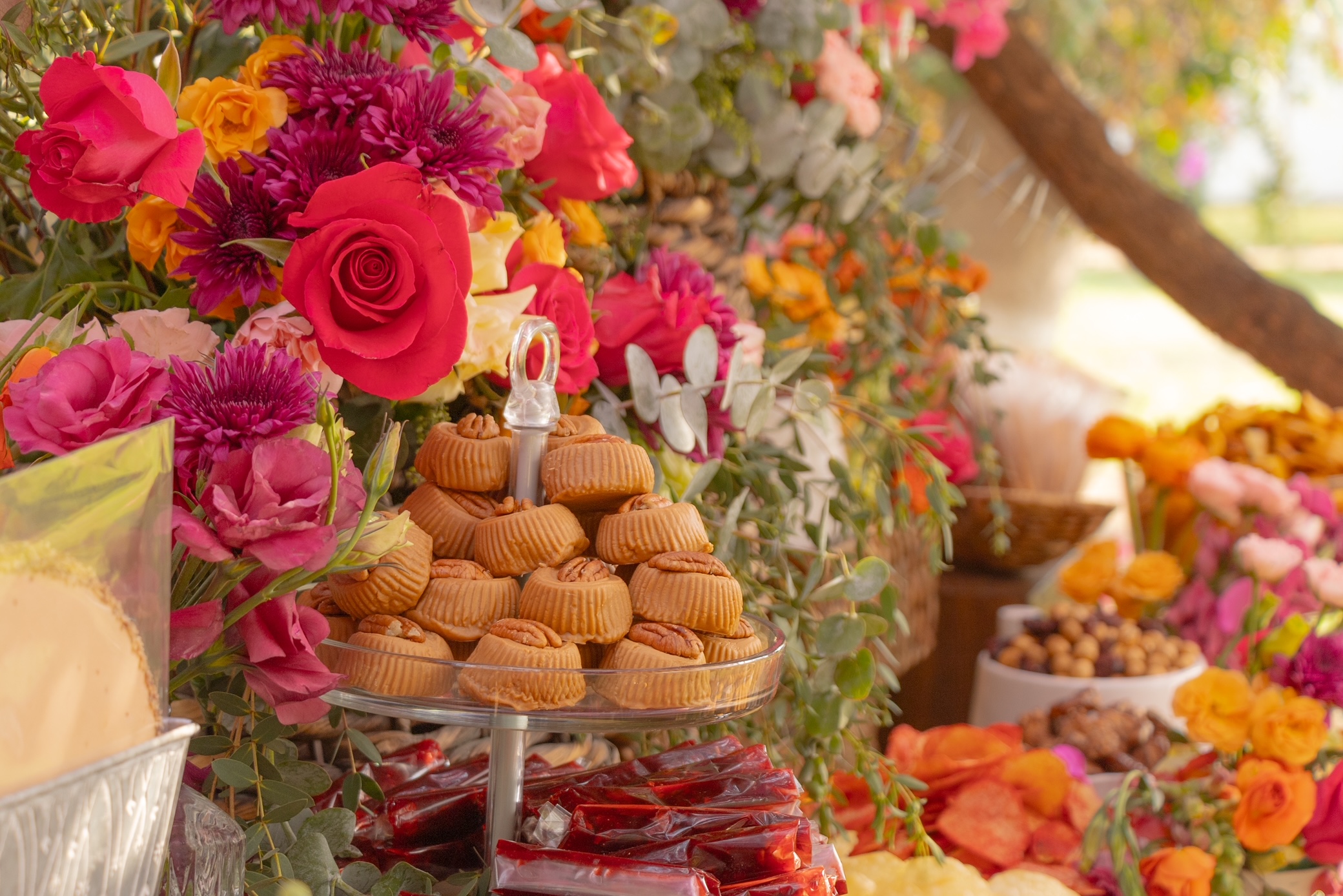 Desk with leather desk pad, walnut desk organizer, wireless keyboard and mouse, and porcelain mug.