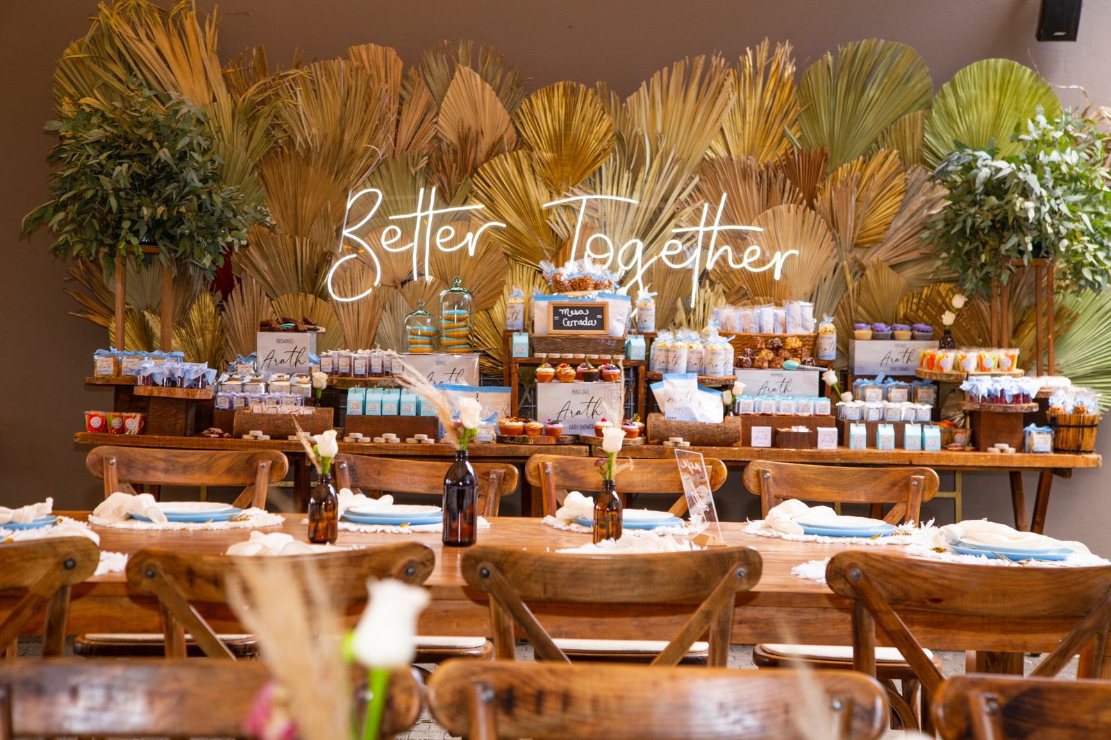 Desk with leather desk pad, walnut desk organizer, wireless keyboard and mouse, and porcelain mug.